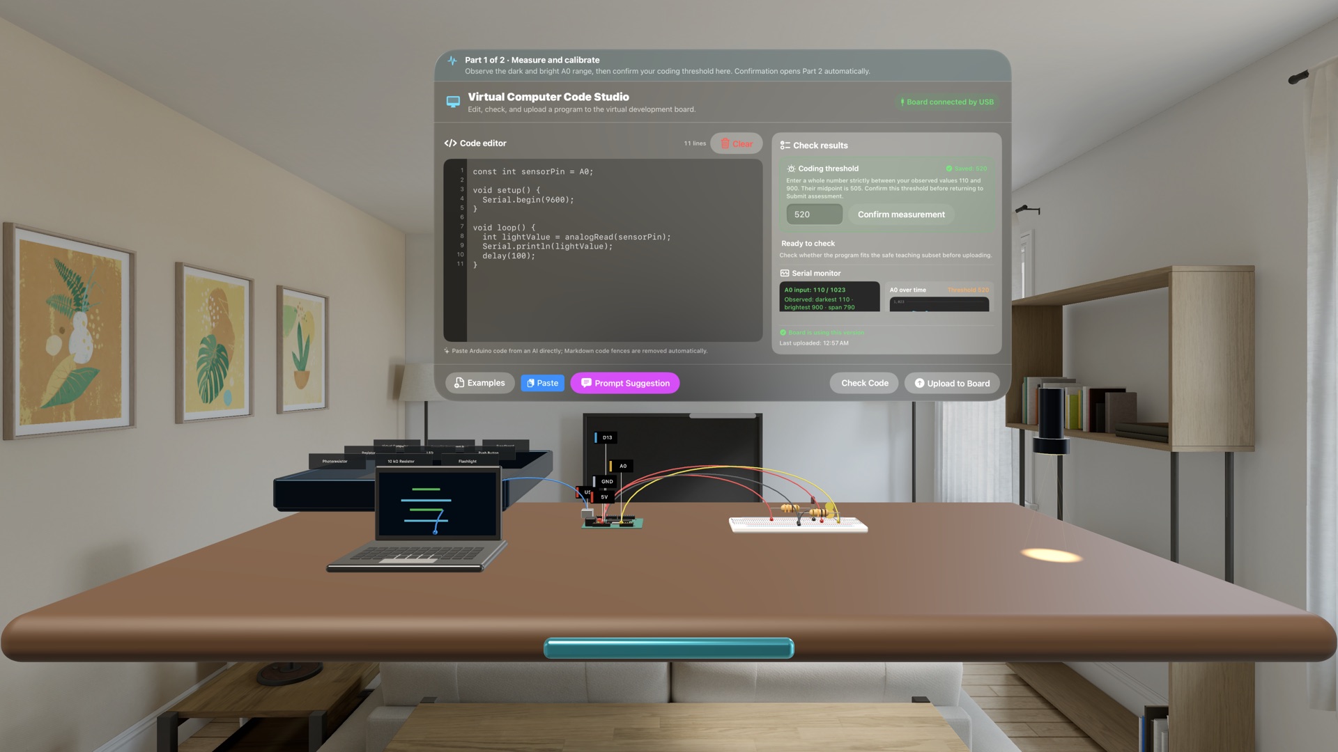 A flashlight illuminating a photoresistor while Code Studio shows A0 readings, calibration range, and a live waveform